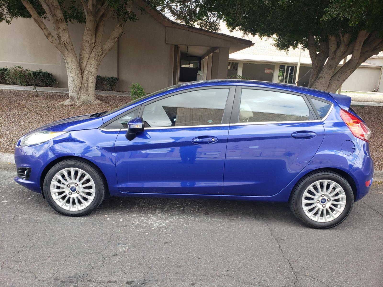 2014 /Tan and black Ford Fiesta Titanium (3FADP4FJ5EM) with an 1.6l i4 engine, 6-Speed Automatic transmission, located at 323 E Dunlap Ave., Phoenix, AZ, 85020, (602) 331-9000, 33.567677, -112.069000 - 2014 Ford Fiesta Titanium,.......A Must See!!... No accidents, Only 95K MILES.... Ice cold AC. The car is gorgeous inside and out. Power windows, Power door locks, Touch screen Stereo/ CD Player, Phone sync, Bluetooth, Satellite compatible, Backup camera, Beautiful tan and black interior with tan le - Photo #6